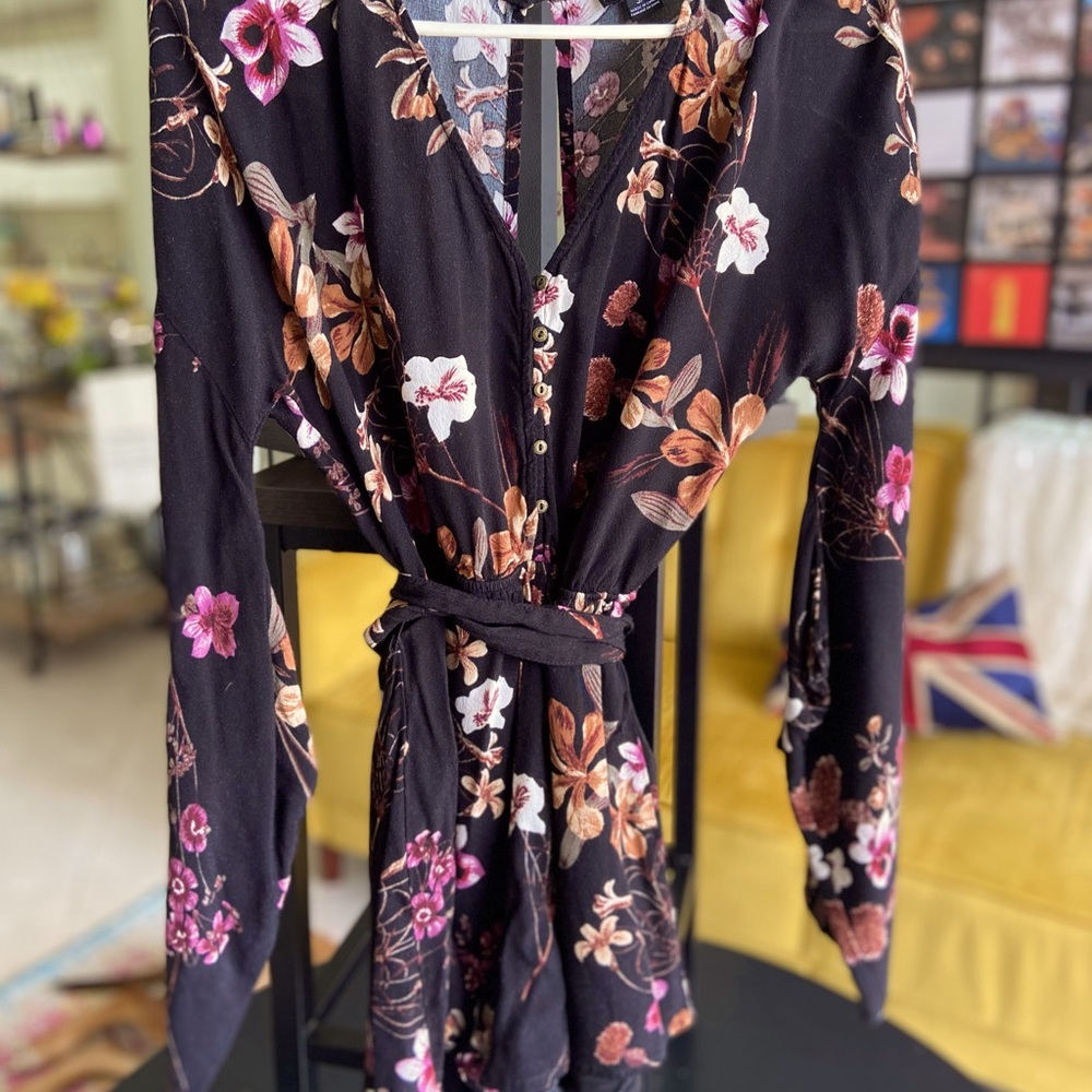 Long sleeve romper with floral detail